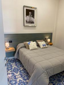 Posteľ alebo postele v izbe v ubytovaní Palazzo De Gregorio Apartment Pompei