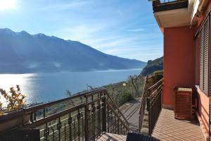 a balcony with a view of a body of water at Mont&Lac in Limone sul Garda