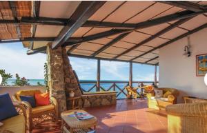 a living room with a view of the ocean at Villa Tina Tropea Costa dei Monaci Parghelia, sabbia fine e bianca e mare cristallino in Mandaradoni +45 photos