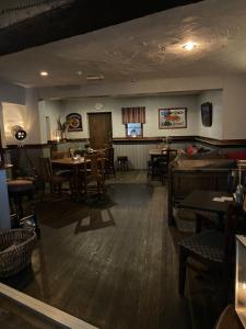 a kitchen filled with furniture and a table at The Royal Oak Inn in Bowness-on-Windermere