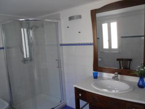 a bathroom with a shower and a sink at Borgo Due Mari in Taranto