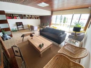 a living room with a couch and a table at La SIGRINA Tuy in Tui