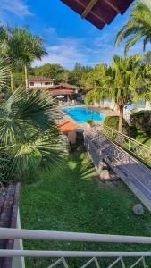 a view of a swimming pool from a balcony at Pousada Chez Nous in Penedo