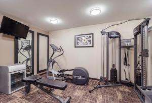 a fitness room with a gym with exercise equipment at Quality Inn & Suites Augusta Fort Eisenhower Area in Augusta