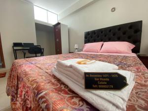 מיטה או מיטות בחדר ב-Residencia Benavides