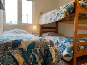 Voodi või voodid majutusasutuse Tantum Concon Apartment toas