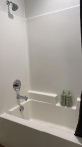 a bathroom sink with a faucet and two soap bottles at Exceptional Loft FREE Parking and WIFI in Los Angeles