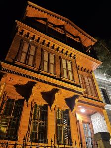 a building with bats painted on the side of it at Thrace Konak Hotel & SPA in Kırklareli