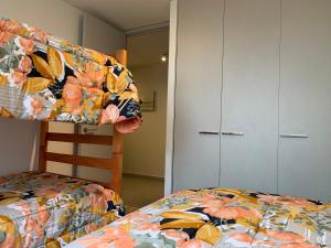 Voodi või voodid majutusasutuse Tantum Concon Apartment toas