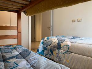 Voodi või voodid majutusasutuse Tantum Concon Apartment toas