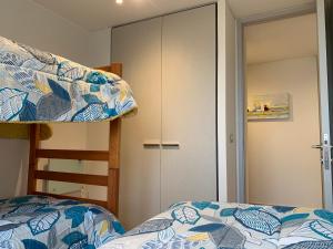 Voodi või voodid majutusasutuse Tantum Concon Apartment toas