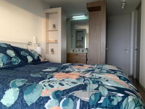 Voodi või voodid majutusasutuse Tantum Concon Apartment toas