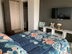 Voodi või voodid majutusasutuse Tantum Concon Apartment toas