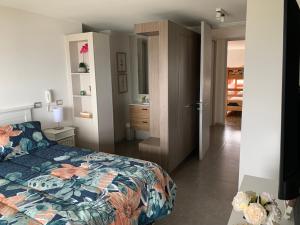 Voodi või voodid majutusasutuse Tantum Concon Apartment toas