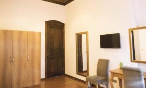 A television and/or entertainment centre at Thrace Konak Hotel & SPA