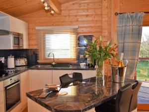 a kitchen with a counter top in a cabin at Pheasant Lodge Scottish Borders in Carlisle