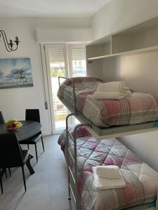 A bed or beds in a room at Appartamento Torre Matilde