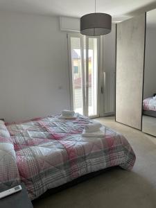 A bed or beds in a room at Appartamento Torre Matilde