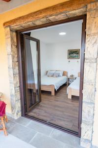 Postel nebo postele na pokoji v ubytování Apartmani Zapis Vrdnik