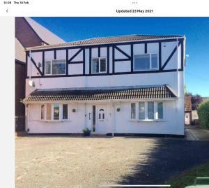 a large white house with a large driveway at Flat 1. Cleethorpes apts in Cleethorpes