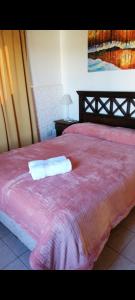 En eller flere senge i et værelse på Los Cardones