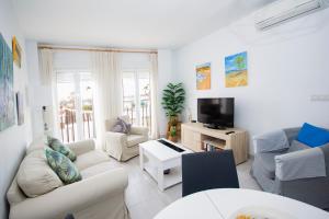 TV a/nebo společenská místnost v ubytování Apartamento con Vistas al mar