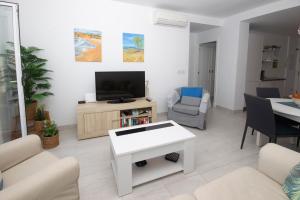 TV a/nebo společenská místnost v ubytování Apartamento con Vistas al mar