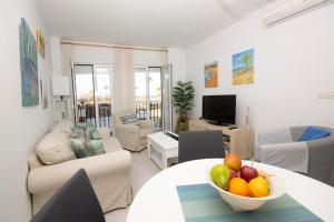 TV a/nebo společenská místnost v ubytování Apartamento con Vistas al mar