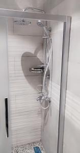a shower with a glass door in a bathroom at ArwaHotel Apartments اروى للشقق الفندقية in Aqaba +53 photos
