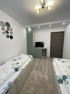 เตียงในห้องที่ Chilia 2 Apartments