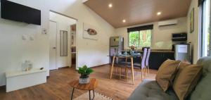 a living room with a couch and a table at Alloro Jungle Villas in Puerto Viejo