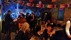 a group of people sitting in a bar at Hotel Restaurant Klostermühle in Reutlingen