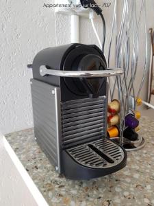 a toaster sitting on top of a counter at Grands studios vue sur lac in Tignes