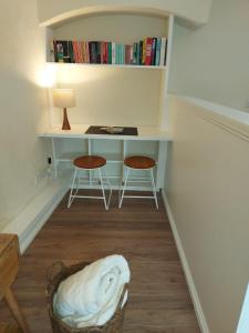 a room with a desk and two chairs and a table at Loft in Bungay in Bungay