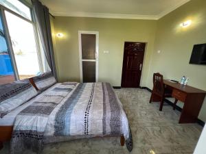 Postel nebo postele na pokoji v ubytování PHYLLEN HOTEL