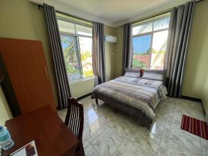 Postel nebo postele na pokoji v ubytování PHYLLEN HOTEL