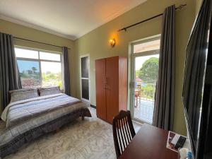 Postel nebo postele na pokoji v ubytování PHYLLEN HOTEL
