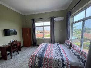 Postel nebo postele na pokoji v ubytování PHYLLEN HOTEL