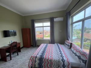 TV a/nebo společenská místnost v ubytování PHYLLEN HOTEL