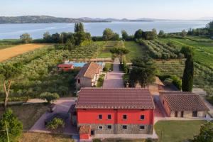 an aerial view of a farm with a red house at Lagolivo in Passignano sul Trasimeno