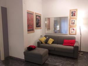 a living room with a couch and a mirror at Holiday Home Pescara in Pescara