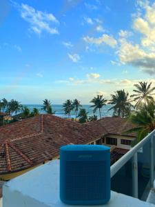 a view of the ocean from the balcony of a house at Sea view A in Mount Lavinia