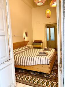 Een bed of bedden in een kamer bij L'Officina