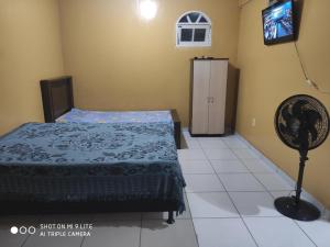 Postel nebo postele na pokoji v ubytování Kitnets Coroa vermelha Coroa