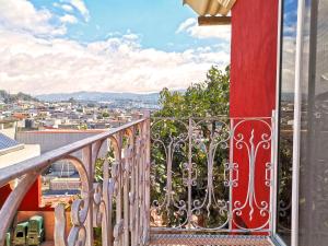 a balcony with a view of a city at Life Builders in Guatemala