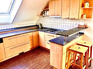 Kuchyň nebo kuchyňský kout v ubytování Apartmány Vojta