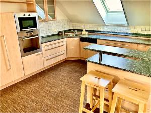Kuchyň nebo kuchyňský kout v ubytování Apartmány Vojta