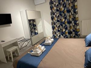 A bed or beds in a room at B&B m’ama non m’ama