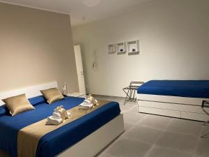 A bed or beds in a room at B&B m’ama non m’ama