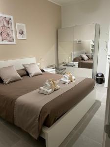 A bed or beds in a room at B&B m’ama non m’ama
